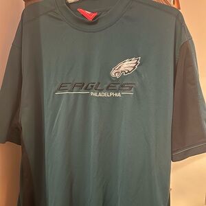 Performance material NFL brand Eagles shirt. Dark green with black color block